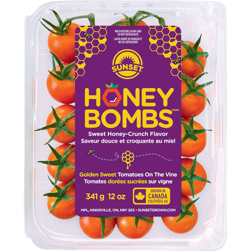 Tomates dorées sucrées sur vigne